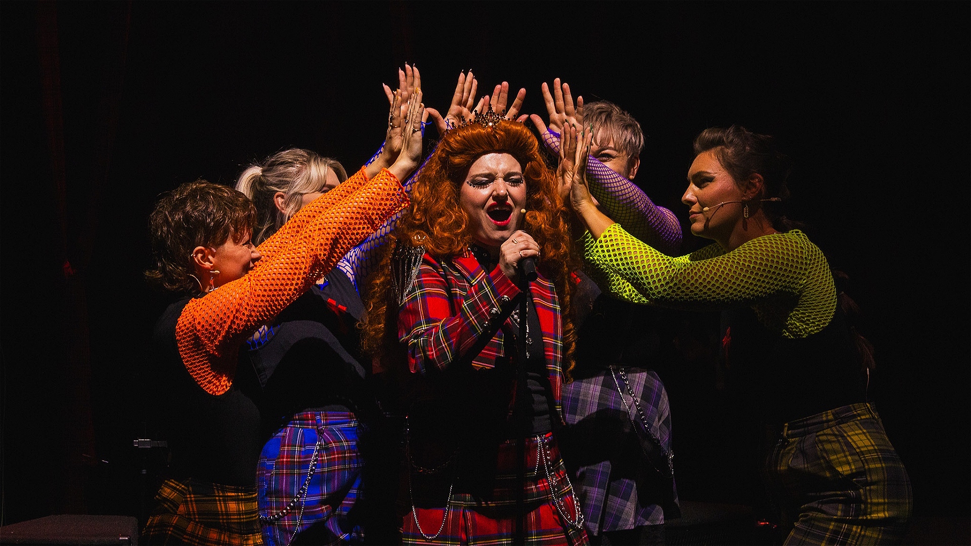 Mhairi MaCall as 'Mary' surrounded by the cast of 'Mary Queen of Rock!'